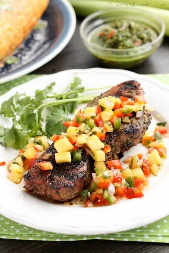 This restaurant-quality steak is marinated in an herbed chimichurri sauce, grilled to perfection, and topped with a spicy-sweet pineapple salsa. 