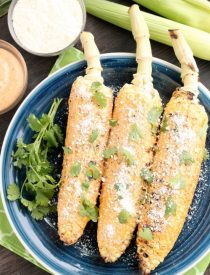 This Mexican Corn on the Cob is grilled and slathered in a chili-lime mayo. Finish it off with a sprinkle of cheese and you won't want corn on the cob any other way!