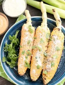 This Mexican Corn on the Cob is grilled and slathered in a chili-lime mayo. Finish it off with a sprinkle of cheese and you won't want corn on the cob any other way!