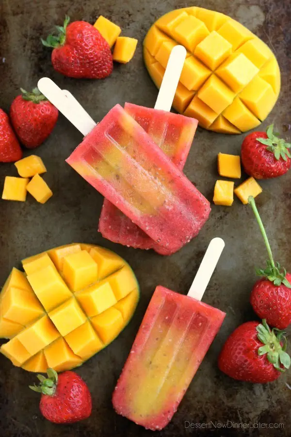 Beat the summer heat with these Strawberry Mango Chia Popsicles! Fresh fruit, chia seeds, and coconut water is all you need to whip up these hydrating pops.