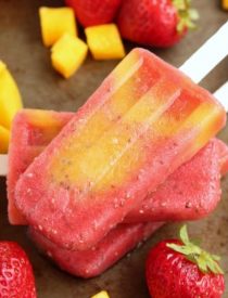 Beat the summer heat with these Strawberry Mango Chia Popsicles! Fresh fruit, chia seeds, and coconut water is all you need to whip up these hydrating pops.