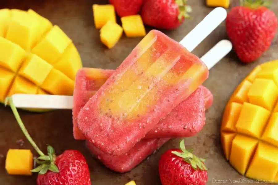 Beat the summer heat with these Strawberry Mango Chia Popsicles! Fresh fruit, chia seeds, and coconut water is all you need to whip up these hydrating pops.