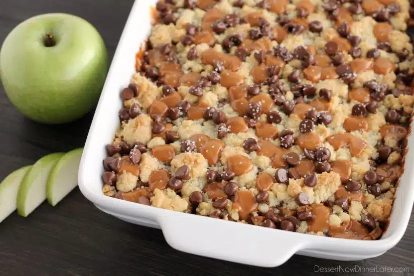 Chocolate Caramel Apple Crumb Bars - These dessert bars have a buttery crust and crumble on top, a gooey cinnamon-sugar apple filling, with caramels, chocolate chips, and sea salt sprinkled on top.