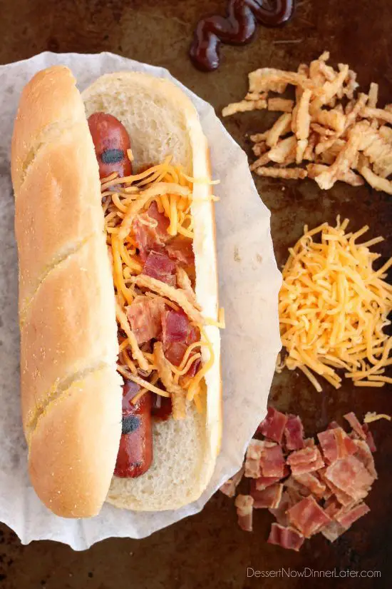 This gourmet Western Hot Dog is made with Ball Park Park's Finest all beef hot dogs topped BBQ sauce, french fried onions, shredded cheddar cheese, and real bacon bits.