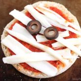 Mini Mummy Pizzas are a fun and easy food the kids can make for Halloween!