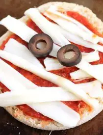 Mini Mummy Pizzas are a fun and easy food the kids can make for Halloween!