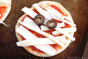 Mini Mummy Pizzas are a fun and easy food the kids can make for Halloween!