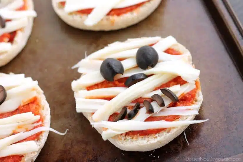 Mini Mummy Pizzas are a fun and easy food the kids can make for Halloween!