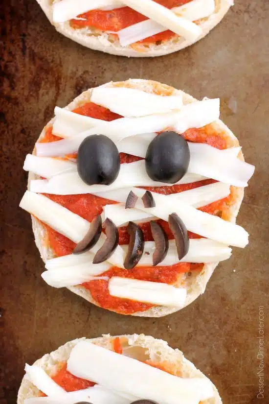 Mini Mummy Pizzas are a fun and easy food the kids can make for Halloween!