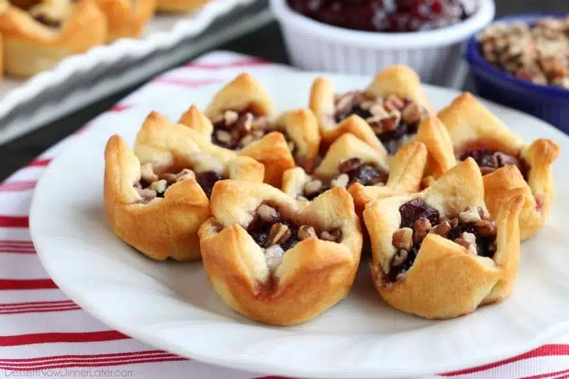 Cranberry Brie Bites are an easy 4-ingredient appetizer for your holiday party. Plus they taste amazing!