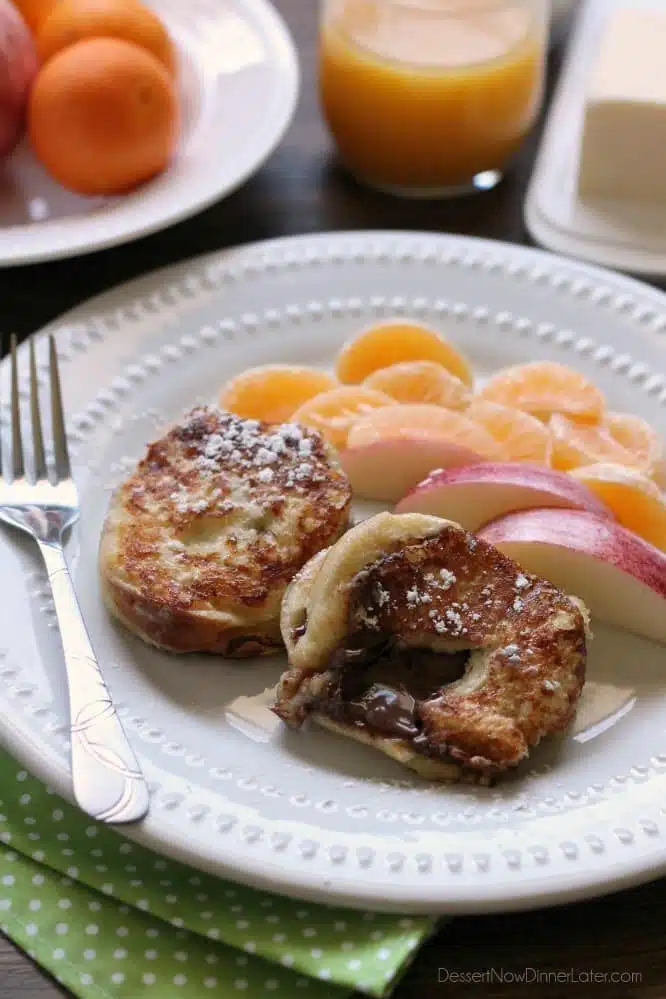 This Chocolate Stuffed French Toast is dipped in a sweet & buttery batter, then grilled until crisp on the outside and melty in the center. A perfect breakfast for the holidays or any time of year!