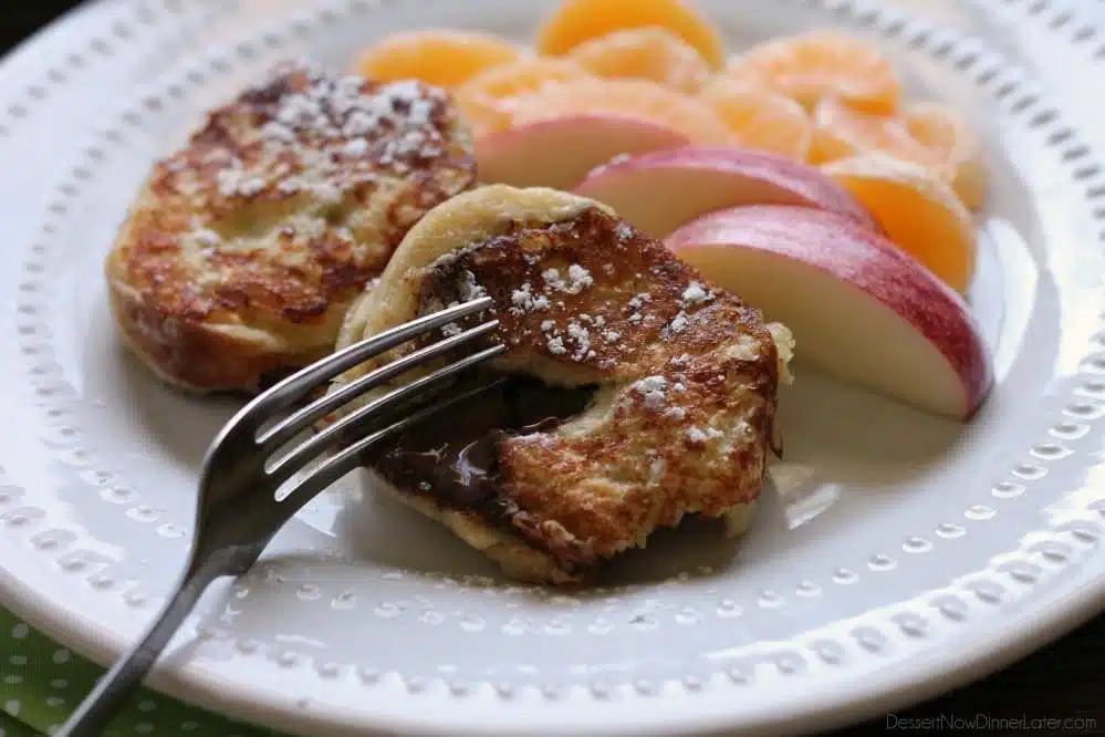 This Chocolate Stuffed French Toast is dipped in a sweet & buttery batter, then grilled until crisp on the outside and melty in the center. A perfect breakfast for the holidays or any time of year!