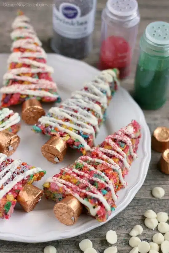 Fruity Pebbles cereal lights up these festive Krispie Treat Christmas Trees that are easy and fun to make for the holidays!