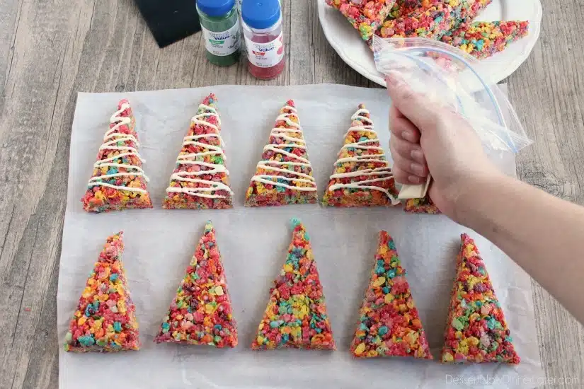 Fruity Pebbles cereal lights up these festive Krispie Treat Christmas Trees that are easy and fun to make for the holidays!