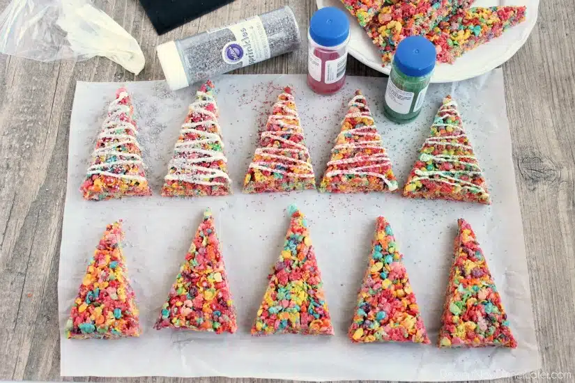 Fruity Pebbles cereal lights up these festive Krispie Treat Christmas Trees that are easy and fun to make for the holidays!