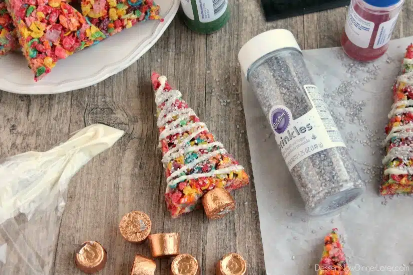 Fruity Pebbles cereal lights up these festive Krispie Treat Christmas Trees that are easy and fun to make for the holidays!