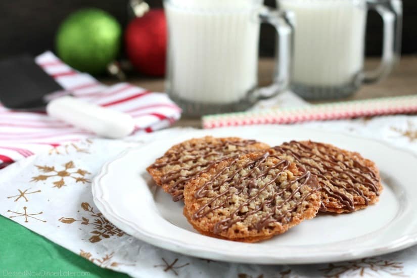 Thin, crisp, buttery cookies are sandwiched between melted milk chocolate with an extra chocolate drizzle on top. They taste like toffee and they look like lace. These Florentine Cookies are a holiday favorite!