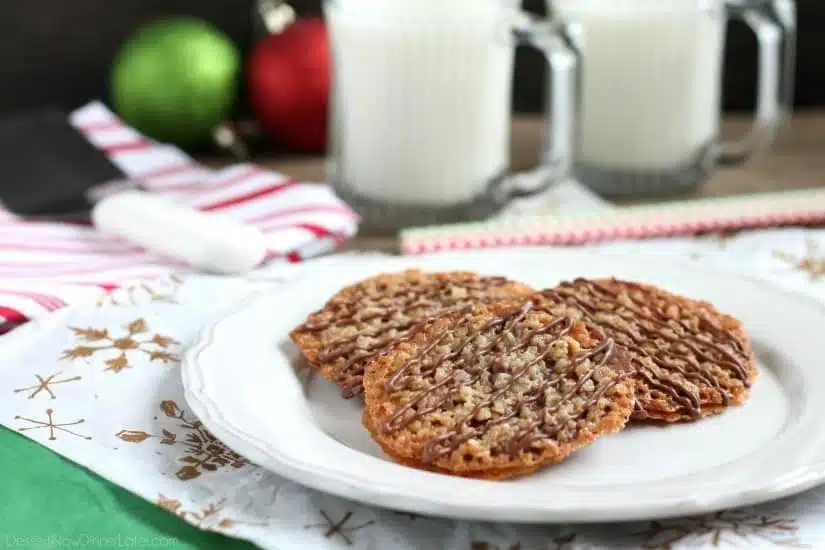 Thin, crisp, buttery cookies are sandwiched between melted milk chocolate with an extra chocolate drizzle on top. They taste like toffee and they look like lace. These Florentine Cookies are a holiday favorite!