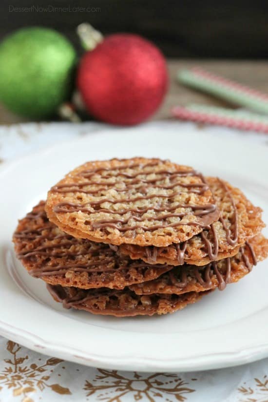 Thin, crisp, buttery cookies are sandwiched between melted milk chocolate with an extra chocolate drizzle on top. They taste like toffee and they look like lace. These Florentine Cookies are a holiday favorite!