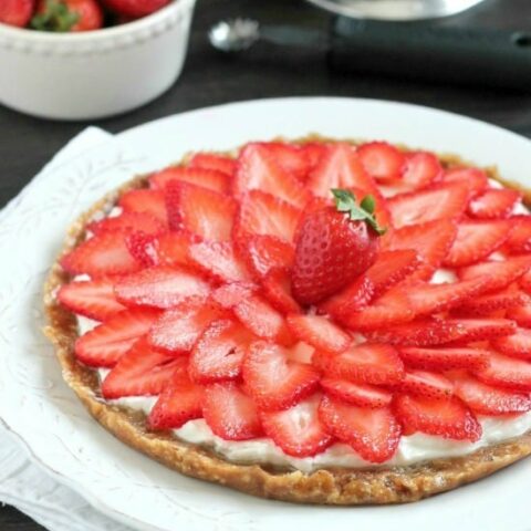 This Strawberry Greek Yogurt Tart is a delicious and healthy Valentine's Day dessert! It's even healthy enough to eat for breakfast too!