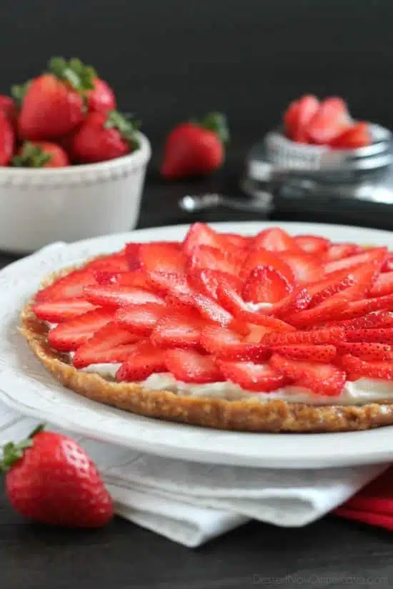 This Strawberry Greek Yogurt Tart is a delicious and healthy Valentine's Day dessert! It's even healthy enough to eat for breakfast too!