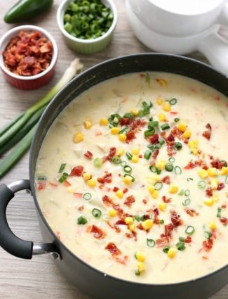 This Creamy Chicken and Corn Chowder is hearty and comforting with generous helpings of chicken, corn, bacon, green onions, potatoes and a slight kick of jalapeño.