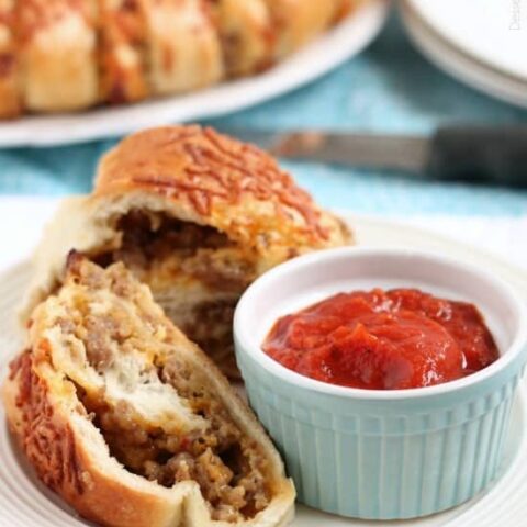 This Sausage Stromboli is a delicious hot sandwich that feeds a crowd! Make it for dinner or as an appetizer served with marinara for the big football game!