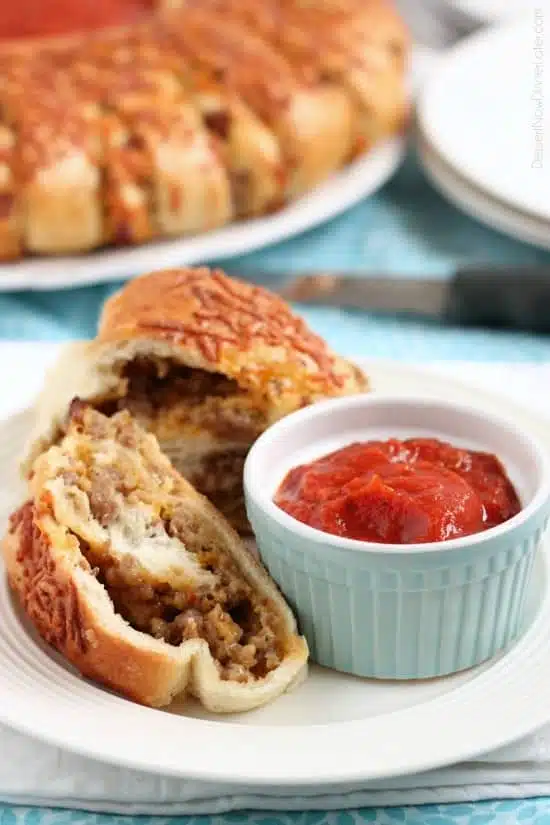 This Sausage Stromboli is a delicious hot sandwich that feeds a crowd! Make it for dinner or as an appetizer served with marinara for the big football game!