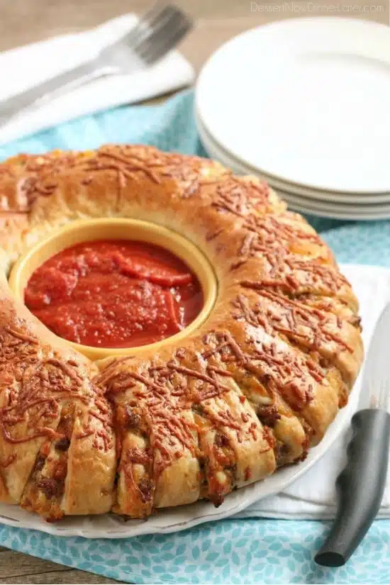 This Sausage Stromboli is a delicious hot sandwich that feeds a crowd! Make it for dinner or as an appetizer served with marinara for the big football game!