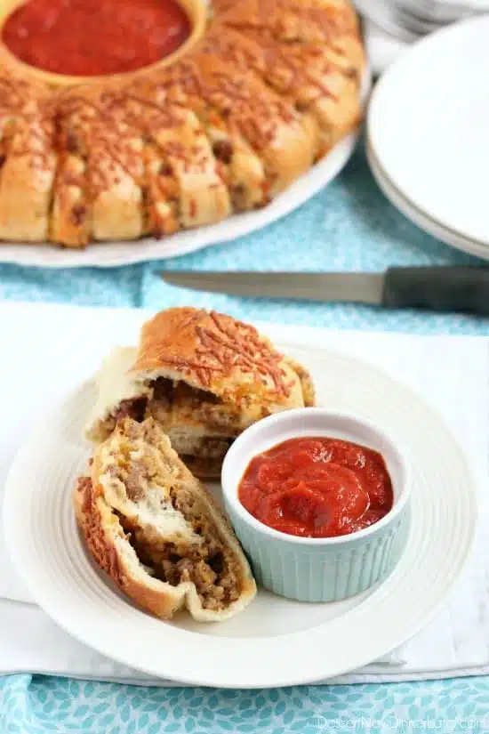 This Sausage Stromboli is a delicious hot sandwich that feeds a crowd! Make it for dinner or as an appetizer served with marinara for the big football game!