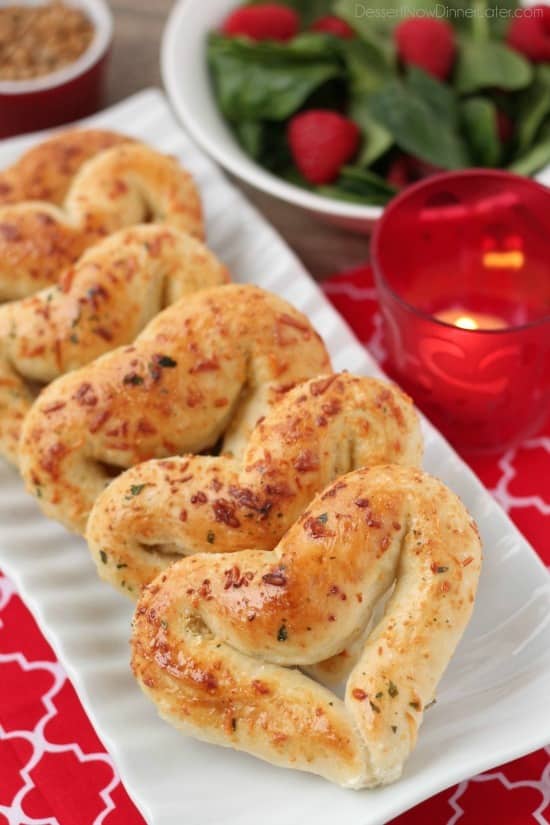 Heart Shaped Breadsticks stacked on a plate.