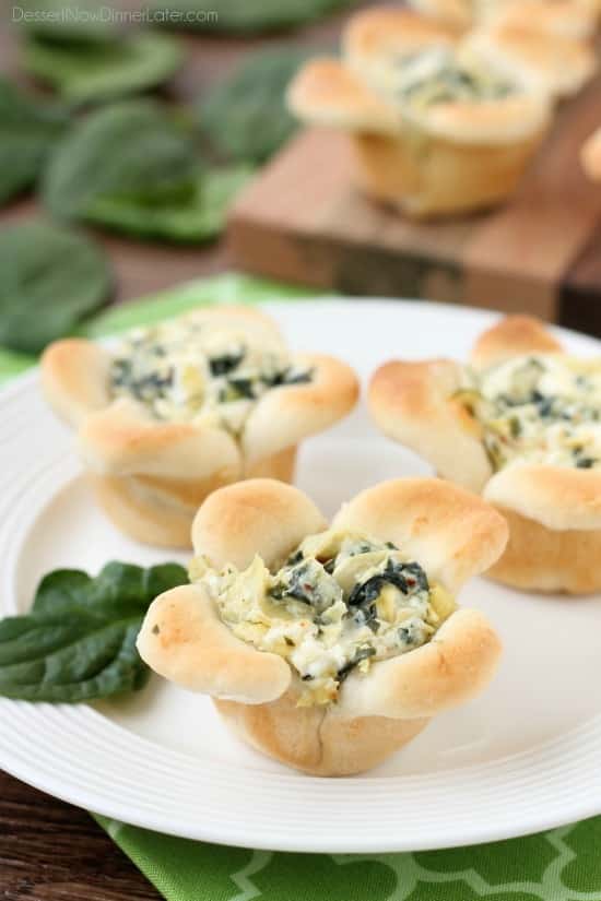 Creamy Spinach Artichoke Dip is baked in the center of bread cups that are shaped to look like blooming flowers. A fun and delicious Easter appetizer.