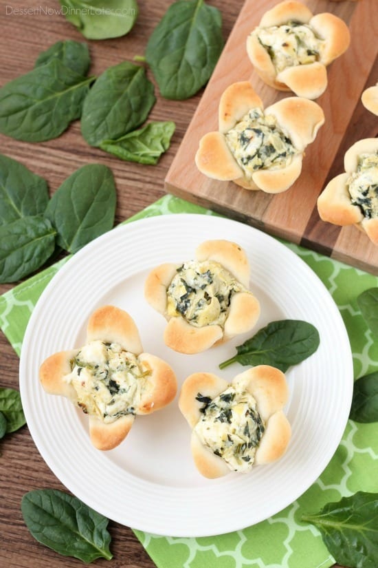 Creamy Spinach Artichoke Dip is baked in the center of bread cups that are shaped to look like blooming flowers. A fun and delicious Easter appetizer.