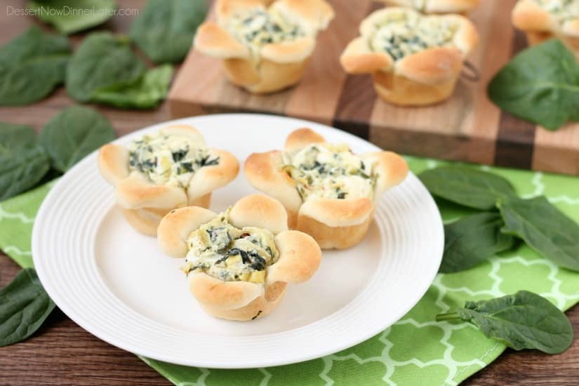 Creamy Spinach Artichoke Dip is baked in the center of bread cups that are shaped to look like blooming flowers. A fun and delicious Easter appetizer.