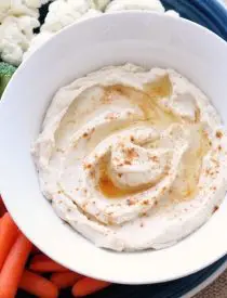 This low carb cauliflower hummus is smooth, creamy, and full of savory garlic flavor!