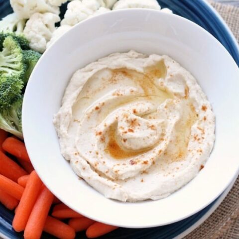 This low carb cauliflower hummus is smooth, creamy, and full of savory garlic flavor!