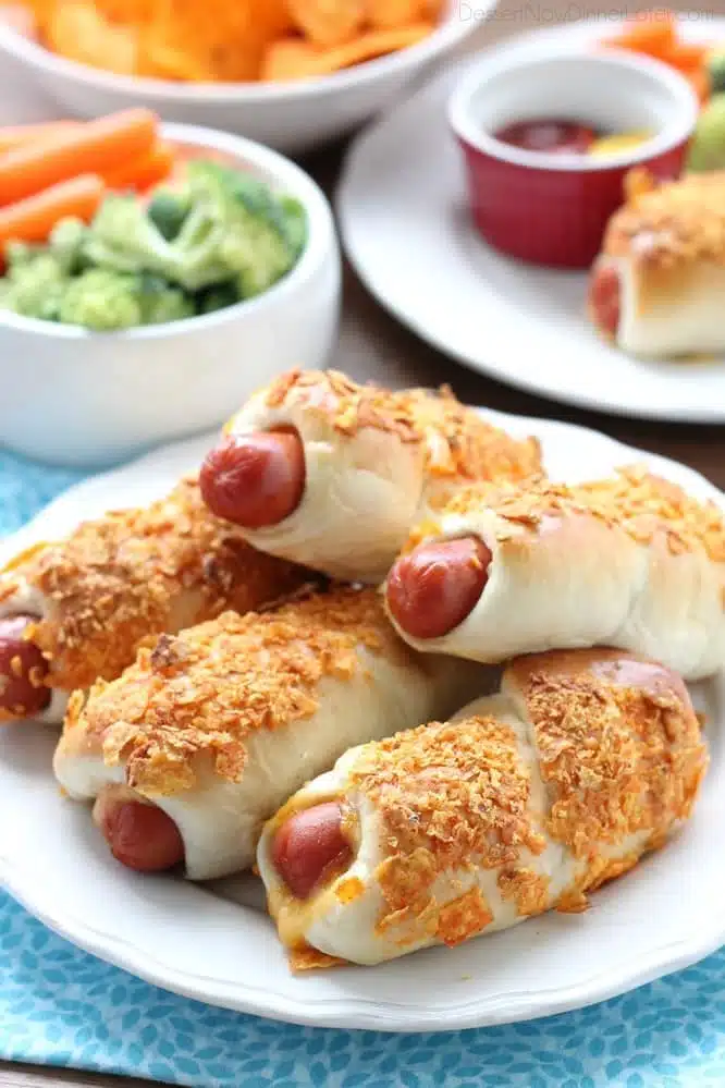 Frozen dough, nacho tortilla chips, and extra cheese transform ordinary pigs in a blanket into these extraordinary crunchy nacho dogs. 