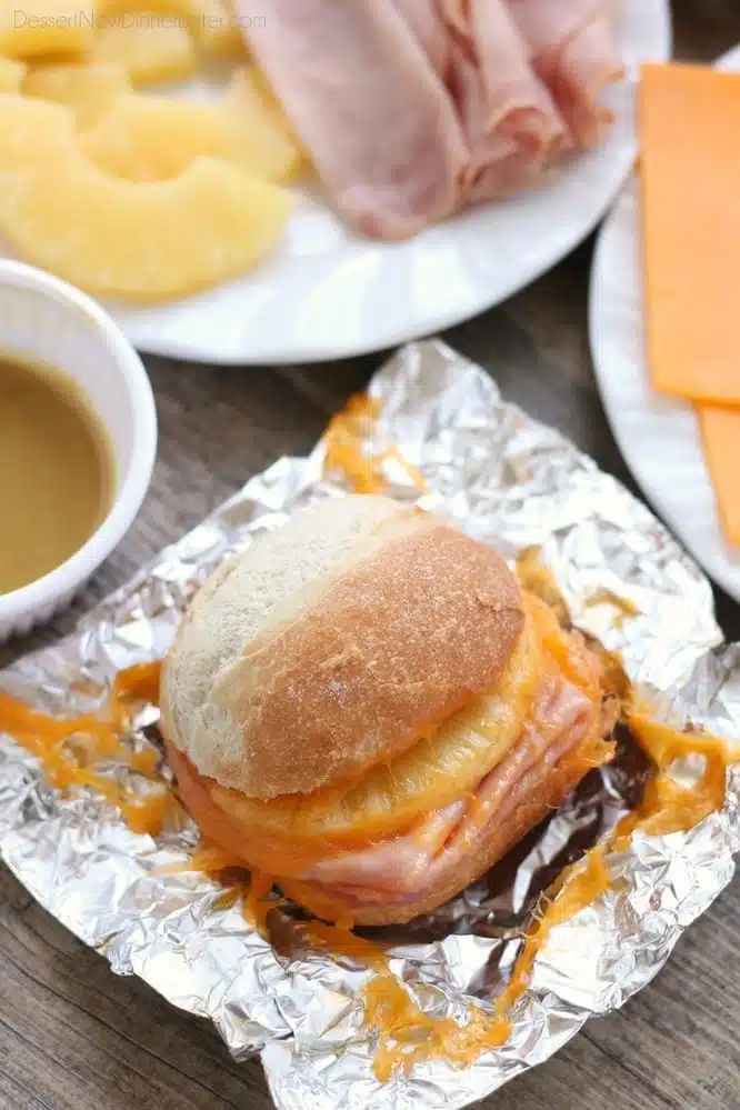 These Hot Ham and Pineapple Campfire Sandwiches are a delicious and easy tin foil recipe. Plus cleanup is a breeze! (You can even bake these in the oven too!)