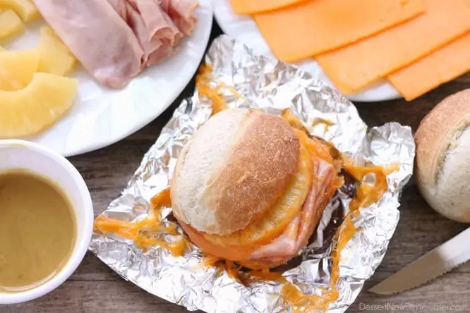 These Hot Ham and Pineapple Campfire Sandwiches are a delicious and easy tin foil recipe. Plus cleanup is a breeze! (You can even bake these in the oven too!)