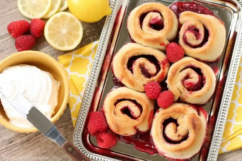 Sticky Raspberry Lemon Rolls are made easy with frozen dough and are topped with a sweet and citrusy lemon cream cheese frosting.