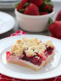 These strawberries and cream crumb bars are sweet and creamy with a buttery crumb crust and topping.