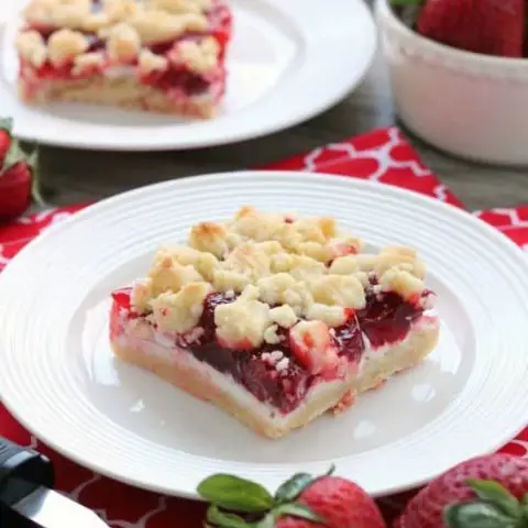 These strawberries and cream crumb bars are sweet and creamy with a buttery crumb crust and topping.