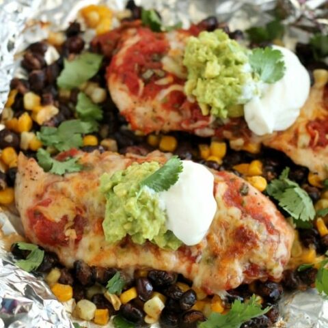 These Southwestern Chicken Packets are an easy and delicious tin-foil dinner recipe you can cook with a fire (while camping), on a grill, or in an oven.