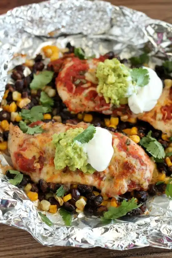 These Southwestern Chicken Packets are an easy and delicious tin-foil dinner recipe you can cook with a fire (while camping), on a grill, or in an oven.