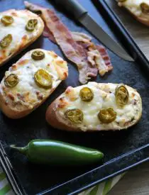Jalapeno Popper Bread can double as a delicious appetizer or easy pizza dinner with bacon, cream cheese, and jalapeno slices for maximum flavor!