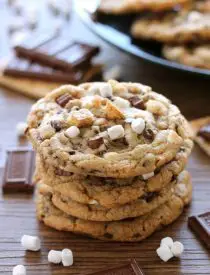 These S'mores Cookies are made with a graham cracker cookie dough, miniature chocolate chips, and marshmallows bits for a great alternative to campfire s'mores that is equally as tasty.