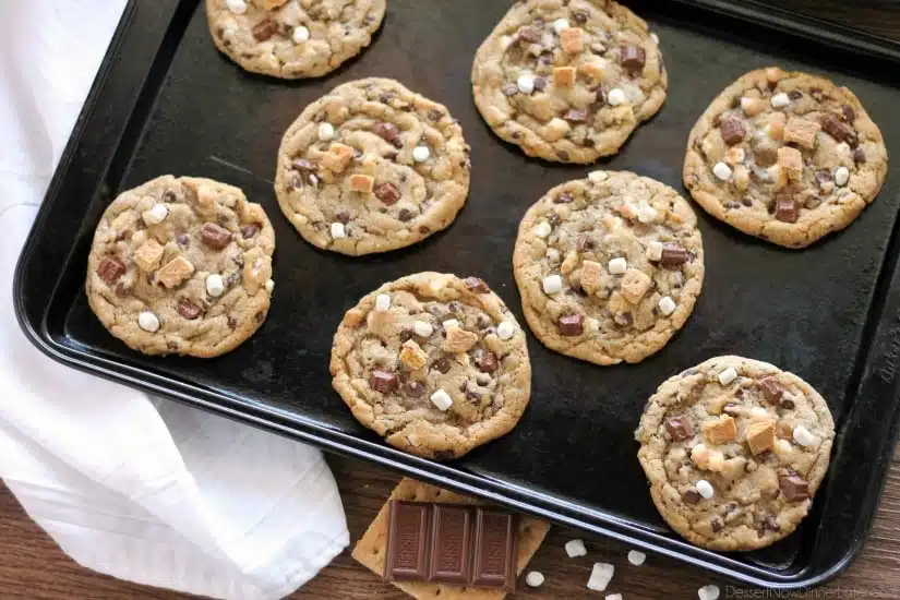 These S'mores Cookies are made with a graham cracker cookie dough, miniature chocolate chips, and marshmallows bits for a great alternative to campfire s'mores that is equally as tasty. 