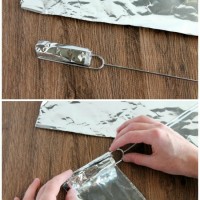 Make your own DIY Woof 'Em Stick with a regular hot dog roasting stick and heavy duty foil.