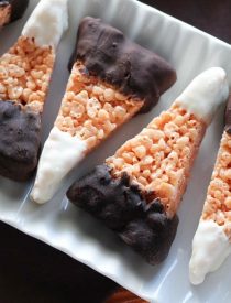Chocolate Dipped Candy Corn Rice Krispie Treats are a fun and easy Halloween treat that the whole family will enjoy!