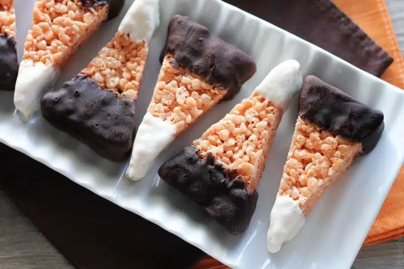 Chocolate Dipped Candy Corn Rice Krispie Treats are a fun and easy Halloween treat that the whole family will enjoy!